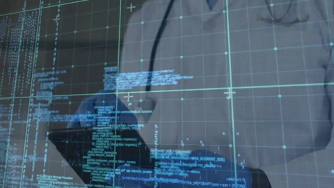Gloved hand tapping tablet screen activating code grid while masked doctor Stock Footage 311046356
