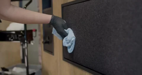 Gloved Hand Wiping Dark Textured Mat With Blue Microfiber Cloth Stock Footage 340274527