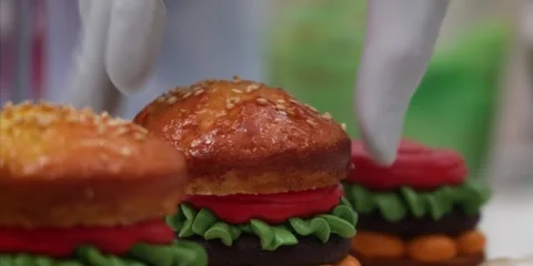 Gloved Hands Arranging Creative Hamburger Cupcakes Close Up Stock-Footage 343588852