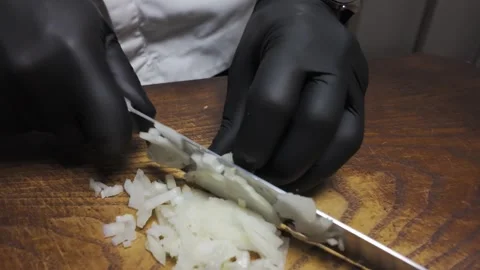 Gloved hands chop fresh onions Stock Footage 301666642