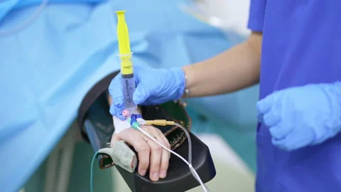 Gloved hands of a doctor make injection to a patient. Stock Footage 212432968