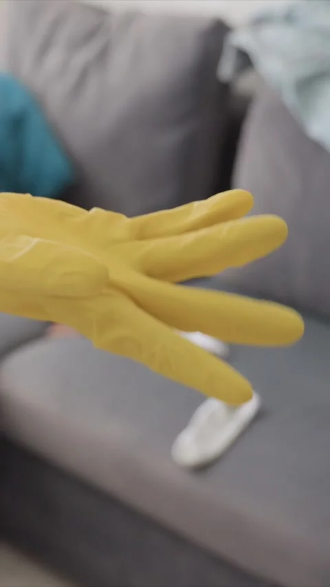 Gloved Hands Gripping Mop Handle During Indoor Cleaning Task featuring gloves Stock Footage 346794668