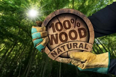 Gloved Hands Holding a Tree Trunk with Text One Hundred Percent Natural Wood Stock Photos