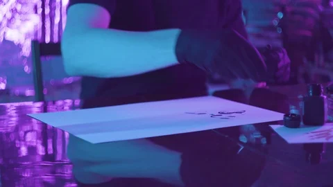 Gloved hands insert the rod into the drawing pen.creative process 库存影片 123575427