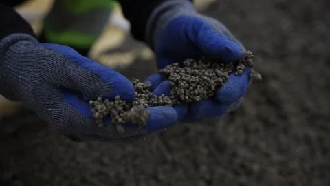 Gloved Hands Inspect Lightweight Aggregate Pellets for Flooring Vídeo Stock 316062251