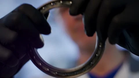 Gloved Hands Inspecting Metal Ball Bearing, Quality Control, Close Up Shot Видео 341489326