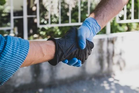 Gloved hands Stock Photos