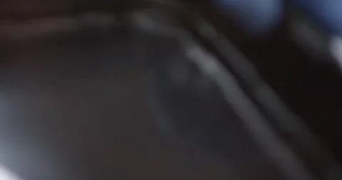 Gloved hands placing dough balls into black tray in food plant, Overhead View Видео 340029959