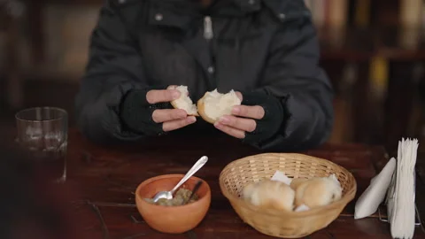 Gloved Hands Preparing Bread with Spread at a Cozy Cafe Table Stock Footage 335989095