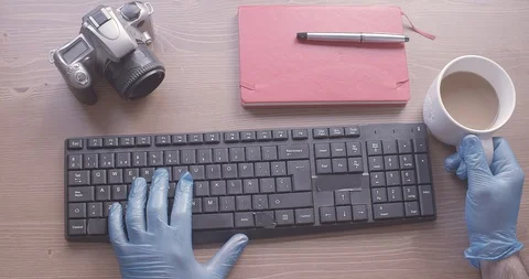 Gloved hands to protect themselves from the coronavirus Stock Footage 129385477