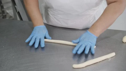 Gloved Hands Rolling Dough Ropes Stock Footage 321544837
