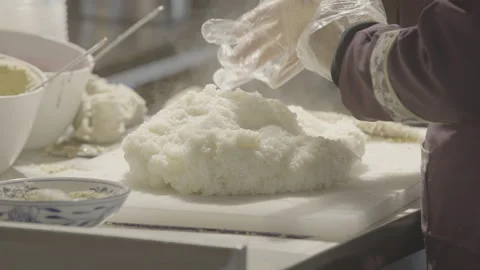 Gloved Hands Shaping White Food Mixture in China 4K Stock Footage 346263993
