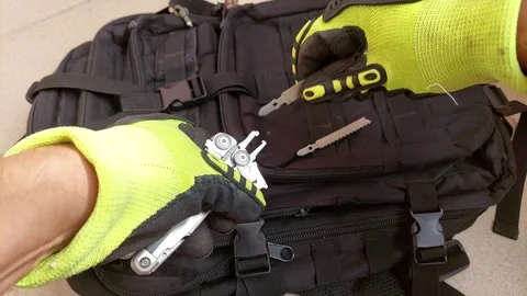 Gloved hands swapping file for saw blade on heavy duty multitool, close up Stock Footage 346706820