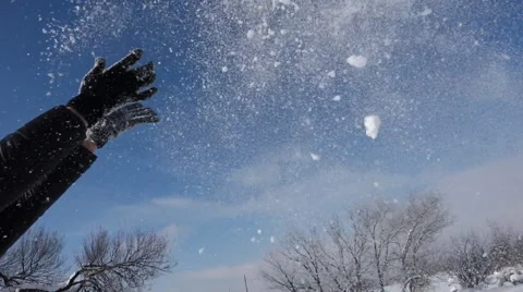 Gloved hands throwing snow slo mo, cu Stock Footage 58801007