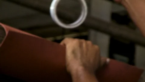 Gloved hands tightening rope on construction site Stock Footage 123728616