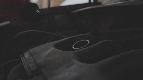 Gloved mechanic opening engine oil cap and steam rising from heat of engine Stock Footage 272522086