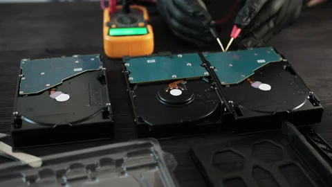 Gloved Technician Hands Testing Damaged Hard Disk Drive During Computer Hardware Stockbeeldmateriaal 336279232