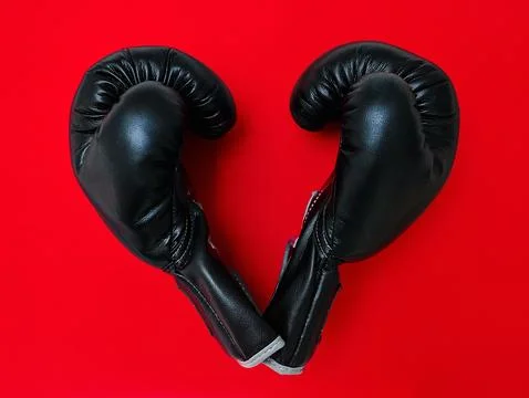 The gloves are off now. High angle shot of a pair of boxing gloves placed Fotos de archivo