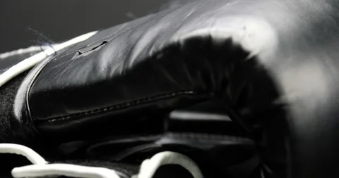 Gloves for boxing close up on boxing gloves isolated on black spinning Video stock 205021685
