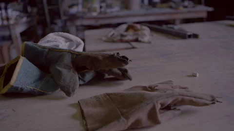 Gloves on a table in a workshop Stock Footage 279775202