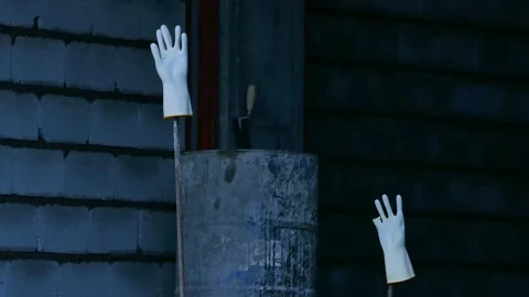 Gloves waving in wind like human hands saying hello Stock Footage 317835059