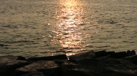 Gloving Water in Sunset Stock Footage 46223849