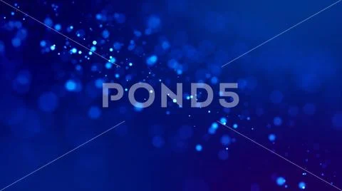 Glow blue particles on blue background are hanging in air for bright festive Stock Photos