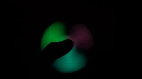 Glow in the dark spinner hand in hand Stock Footage 77547645