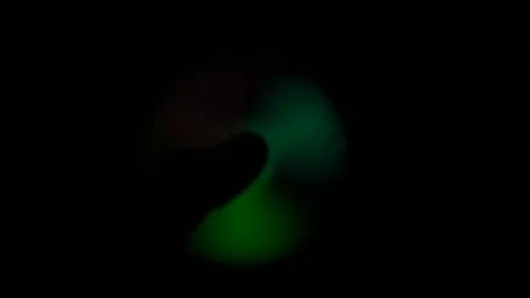 Glow in the dark spinner hand in hand Video stock 77547869