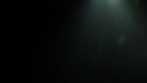 Glow green optical flare light burst on black background Stock Footage 311985473
