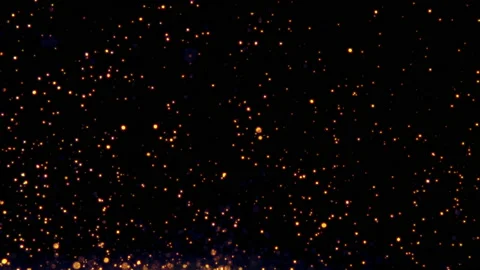 Glow particles flow in the air on black background, glitter sparkling dust Stock Footage 135750041