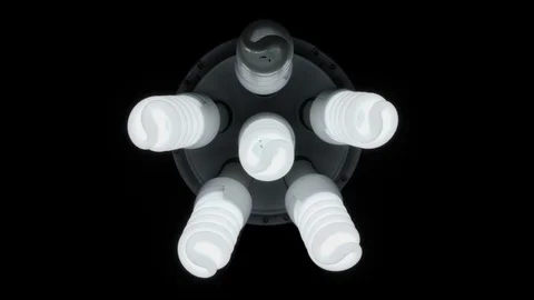 Glow six light bulbs in the form of a man on a dark background Stock Footage 101876276