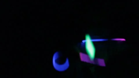 Glow sticks waving in the dark Stock Footage 40214054