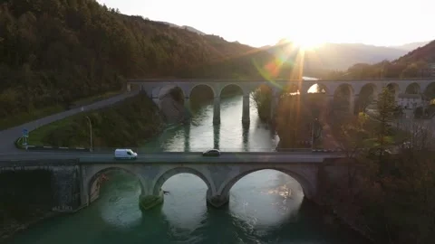 Glow of sunset on train bridge with traffic in Sisteron town Vídeos de archivo 307314271
