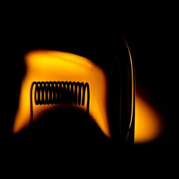 Glower of halogen lightbulb. with stylish effect of optical aberrations. Stock Photos