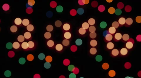 Glowing 2016 and colored lights defocus 2016 Video stock 55970676