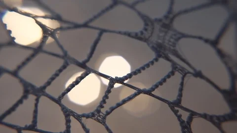 Glowing abstract background with bokeh and lace. 4K macro trucking shot. Stock Footage 99705578