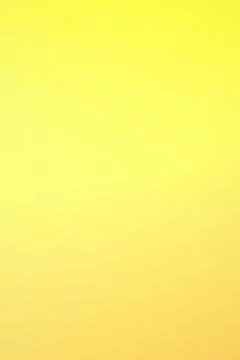 A glowing abstract gradient moves from bright yellow into warm golden tones.. Stock Illustration