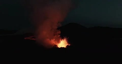 Glowing Active Volcano Crater with Thick Smoke at Night Aerial Stock Footage 322179952