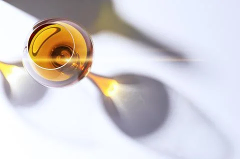 Glowing amber cognac in a snifter Stock Photos