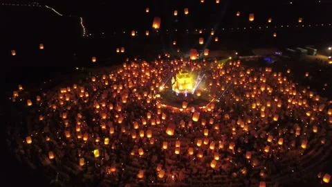 Glowing and flying lanterns drone video Yi Peng Lantern Festival Chiang Mai Stock Footage 231646980