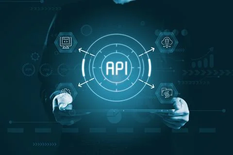 Glowing API hub interface displayed above tablet, showing system connection.. Stock Photos