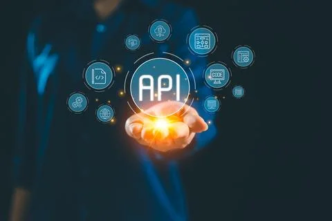 Glowing API interface floating above hand connected digital icon representi.. Foto stock