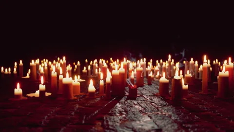 Glowing Array of Lit Candles in the Darkness Stock Footage 287116135