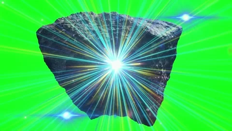 Glowing asteroid with radiating light beams isolated on a green screen Stock Footage 346210850