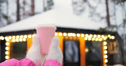 Glowing background frames pink beverage, highlighting branding potential for Stock Footage 301525942