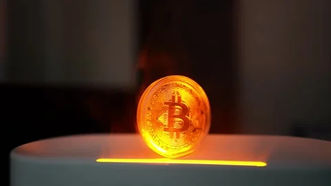 Glowing Bitcoin Coin on Smooth Surface, A glowing Bitcoin coin standing upr.. Vídeo Stock 304876391