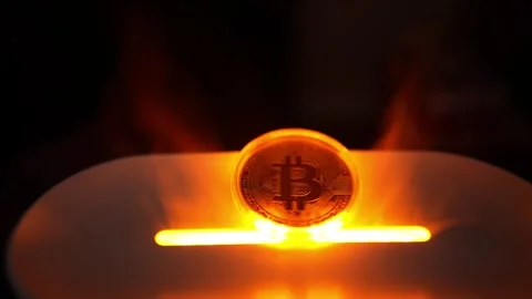 Glowing Bitcoin Coin on Surface, A glowing Bitcoin coin standing upright on.. Видео 304875843