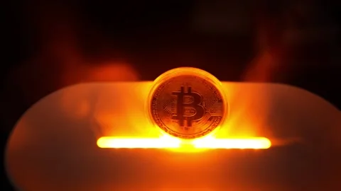 Glowing Bitcoin Coin on Surface, A glowing Bitcoin coin standing upright on.. Vídeos de archivo 304875936