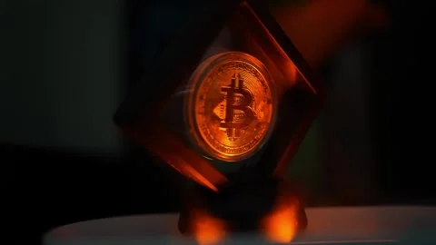 Glowing Bitcoin Symbol in Transparent Cube, A glowing Bitcoin symbol encase.. Stock Footage 304876500